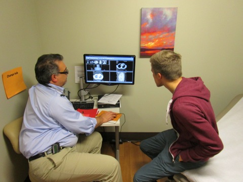 Drew and Dr Lonergan review the results of a CT scan
